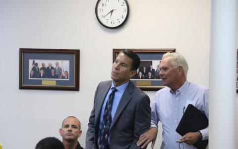 Stephen A. Douglas (left) reacts to being chosen for the District 14 seat at an Oct. 13 meeting. (FILE)
