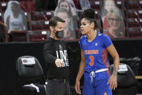 Former Florida head coach Cam Newbauer talks with Lavender Briggs during a game against South Carolina on Dec. 31, 2020, in Columbia, S.C. Briggs said Thursday there are “a bunch of false allegations and narratives going around” regarding what happened during former coach Cam Newbauer’s tumultuous tenure. Several Florida players detailed Newbauer’s abuse, which allegedly included verbal and physical harassment against players, assistants and staff members. (AP FILE)