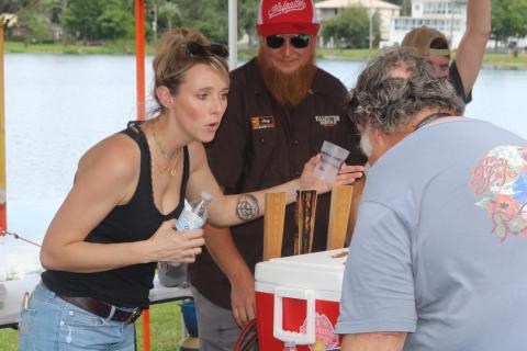 Holly Frazier discusses the options available at Halpatter Brewing Co.’s tent at the 2019 Gateway City Craft Beer and Wine Festival. (FILE)