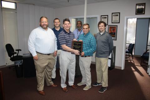 Lake City Reporter Publisher Todd Wilson (from left), Sports Editor Jordan Kroeger, CNI President Mark Major, Reporter Tony Britt, Editor Jamie Wachter and Assistant Editor Morgan McMullen pose with the President’s Award for Outstanding Journalism. (CHRIS RATLIFF/Lake City Reporter)