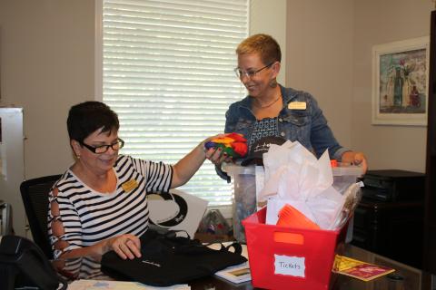 Vicki Morrell (from left), Pregnancy Care Center administrative assistant and Lori North, Pregnancy Care Center Executive Director, pack materials as they prepare for Saturday’s Pregnancy Care Center 5K Walk/Run 4 Life. (TONY BRITT/Lake City Reporter)