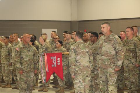 Members of the 868 Engineering Construction Company prepare to ‘case the colors’ on Saturday. (JAMIE WACHTER/Lake City Reporter)