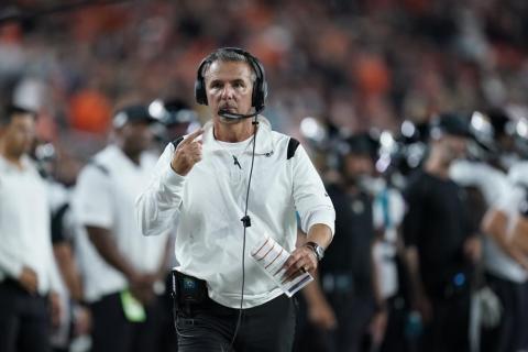 Jacksonville Jaguars head coach Urban Meyer walks with an official during Thursday's game against the Cincinnati Bengals in Cincinnati. (MICHAEL CONROY/Associated Press)