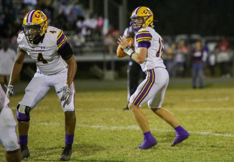 Columbia quarterback Evan Umstead (right) drops back to pass against Madison County last Friday. (BRENT KUYKENDALL/Lake City Reporter)