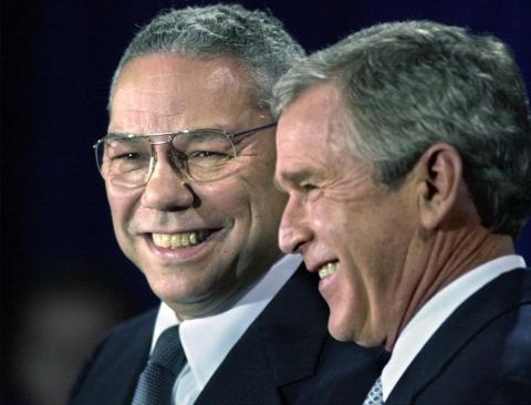In this Dec. 16, 2000 file photo, President-elect Bush smiles as he introduces retired Gen. Colin Powell (left) as his nominee to be secretary of state during a ceremony in Crawford, Texas. Powell, former Joint Chiefs chairman and secretary of state, has died from covid-19 complications. In an announcement on social media Monday, the family said Powell had been fully vaccinated. He was 84. (DAVID J. PHILLIP/Associated Press)