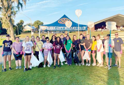 Columbia High School students preparing to pull trash from Lake DeSoto last Saturday as part of the Rotary Club of Lake City - Downtown’s Lake DeSoto Lake Clean-Up event. (COURTESY)