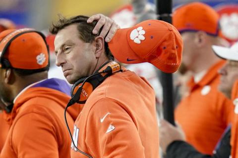 Clemson head coach Dabo Swinney wipes his head as he watches as his team play against Pittsburgh on Oct. 23 in Pittsburgh. Pittsburgh won 27-17. (KEITH SRAKOCIC/Associated Press)