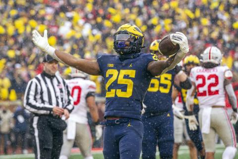 Michigan running back Hassan Haskins (25) celebrates a touchdown against Ohio State on Saturday in Ann Arbor, Mich. Michigan won 42-27. (TONY DING/Associated Press)
