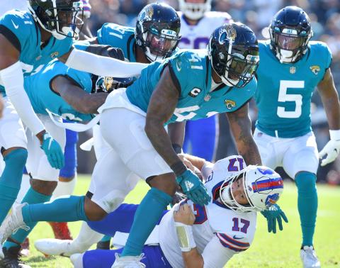 Jacksonville Jaguars linebacker Josh Allen (41) sacks Buffalo Bills quarterback Josh Allen (17) during Sunday's game at TIAA Bank Field in Jacksonville. (BOB SELF/Florida Times-Union/TNS)