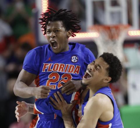 Florida guard Tyree Appleby (22) celebrates with guard Myreon Jones (0) after hitting the game-winning shot against Ohio State at the buzzer on Wednesday in Fort Myers. (SCOTT AUDETTE/Associated Press)