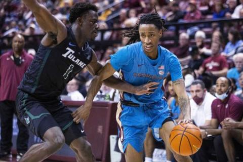 Florida State guard Caleb Mills (4) tries to get past Tulane guard Sion James (1) during Wednesday’s game in Tallahassee, Fla., Wednesday, Nov. 17, 2021. (MARK WALLHEISER/Associated Press)