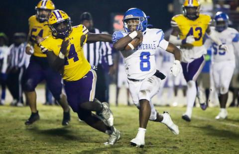 Columbia defensive end Bobby Miller chases after Riverside quarterback Cale Zarah during Friday’s Region 1-6A quarterfinal. (BRENT KUYKENDALL/Lake City Reporter)