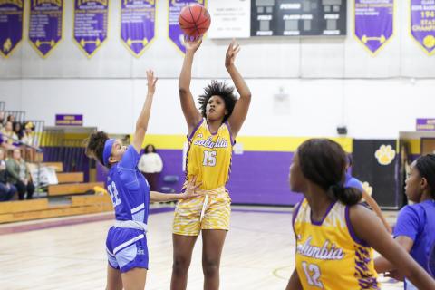 Columbia forward Jolena Gardner shoots over P.K. Yonge forward Niyah Williams on Tuesday night. (BRENT KUYKENDALL/Lake City Reporter)