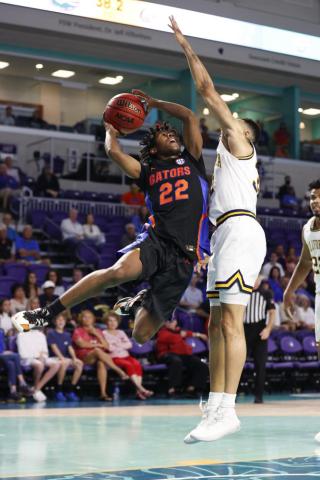 Florida guard Tyree Appleby drives to the basket against California guard Jordan Shepherd during Monday's game in Fort Myers. (SCOTT AUDETTE/Associated Press)