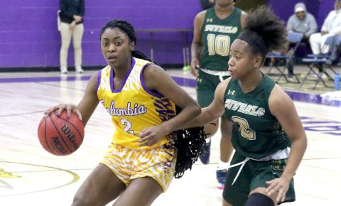 Columbia guard Na’Haviya Paxton drives to the basketball against The Villages Charter on Tuesday night. (JORDAN KROEGER/Lake City Reporter)