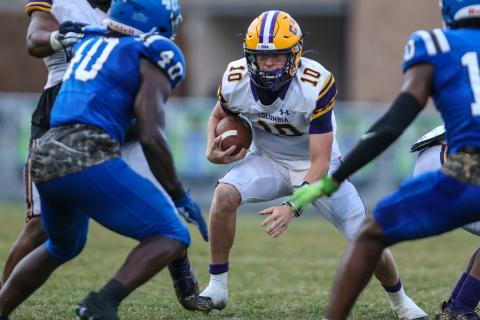 Columbia quarterback Kade Jackson scrambles from pressure against Riverside on Oct. 8. (GARY LLOYD MCCULLOUGH/Special to the Reporter)