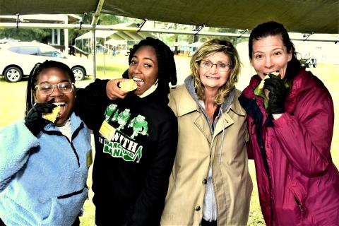 Attendees of the inaugural Wellborn Cornbread Festival take a bite from some local entries to the event. (ROB WOLFE/Special to the Reporter)