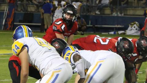 Fort White quarterback Clayton Philpot gets set to take a snap against Newberry on Sept. 3. (FILE)