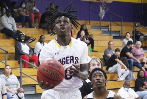 Columbia guard Isaac Broxey rises to shoot against Hawthorne last season. (FILE)