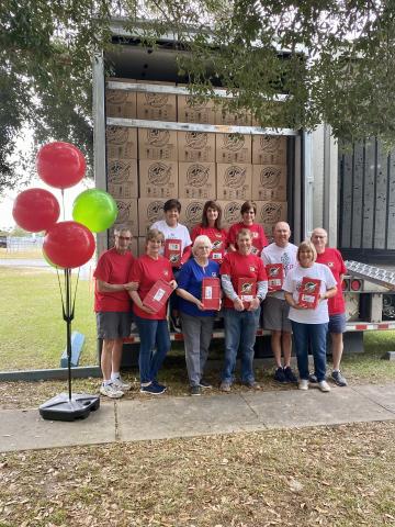 Volunteers at the Operation Christmas Child’s Lake City collection center after loading more than 7,500 shoeboxes on two trucks last week. Pictured are, in front, Rickey Beauchamp (from left), Pam Beauchamp, Emily Harden, Gene Bullard, Jimmy Blanton, Cheryl Cox and Randy Cox; and in back, Beth Bullard, Tracy Osburn and Lou Blanton. (COURTESY)