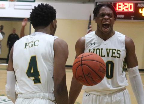 Florida Gateway College forward Omari Jordan yells in celebration after guard Antonio Card (4) scores against Pasco-Hernando-State College on March 4. (JORDAN KROEGER/Lake City Reporter)