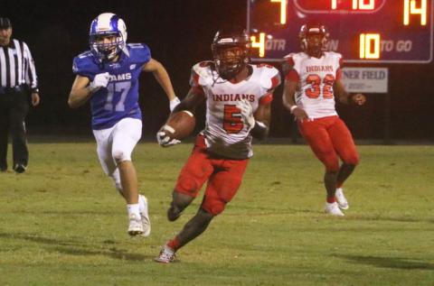 Fort White defensive back Darren Clark returns an interception against Interlachen on Friday. (MORGAN MCMULLEN/Lake City Reporter)