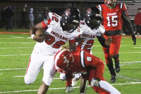 Fort White running back Kamarion Griffin is tackled by Bradford defensive back Jarrin Alexander on Friday night. (MORGAN MCMULLEN/Lake City Reporter)