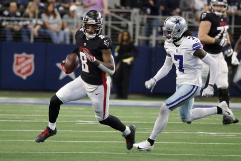 Atlanta Falcons tight end Kyle Pitts (8) catches a pass for a first down as Dallas Cowboys cornerback Trevon Diggs (7) on Nov. 14 in Arlington, Texas. (MICHAEL AINSWORTH/Associated Press)