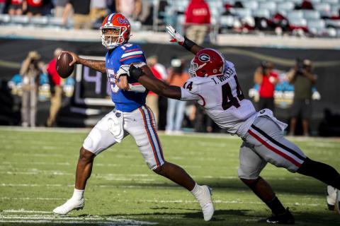 Florida quarterback Anthony Richardson scrabbles out of the pocket while being chased by Georgia defensive lineman Travon Walker (44) on Oct. 30 in Jacksonville. (STEPHEN B. MORTON/Atlanta Journal-Constitution via AP)