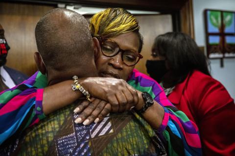 Ahmaud Arbery's mother, Wanda Cooper-Jones, is hugged by a supporter after the jury convicted Travis McMichael in the trial of McMichael, his father, Greg McMichael, and neighbor, William "Roddie" Bryan, on Wednesday in Brunswick, Ga. (STEPHEN B. MORTON/Pool/Getty Images/TNS)