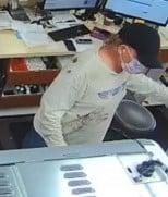 A security footage still from Baya Pharmacy shows the masked suspect. (COURTESY)