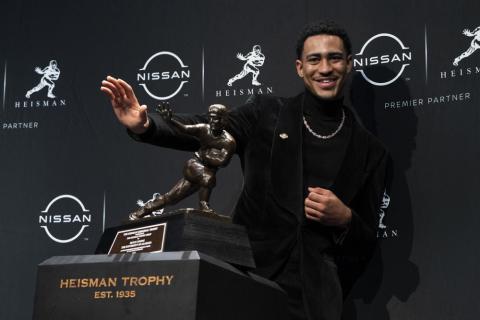 Alabama quarterback Bryce Young poses for a photograph after winning the Heisman Trophy on Saturday in New York. (JOHN MINCHILLO/Associated Press)