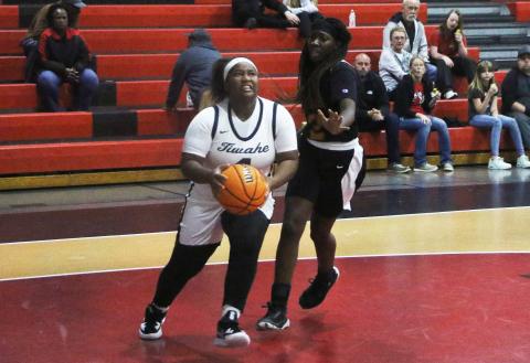Fort White forward N’Coreyia Atkins drives to the basket against Eastside on Friday night. (MORGAN MCMULLEN/Lake City Reporter)