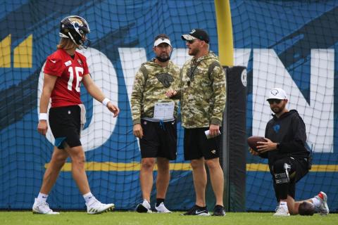 Jacksonville Jaguars interim head coach Darrell Bevell, an offensive coordinator under former coach Urban Meyer, leads practice while talking with quarterback Trevor Lawrence on Dec. 16 at TIAA Bank Field's practice field in Jacksonville. (COREY PERRINE/The Florida Times-Union via AP)