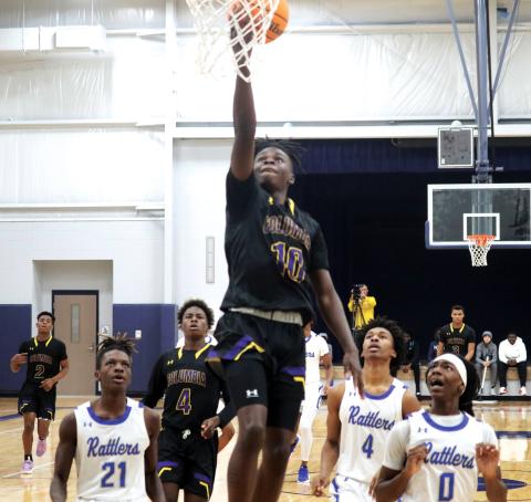 Columbia guard Isaac Broxey rises to score a layup against Belleview during the Hitchcock’s Challenge at Legacy Park on Tuesday in Alachua. (JORDAN KROEGER/Lake City Reporter)