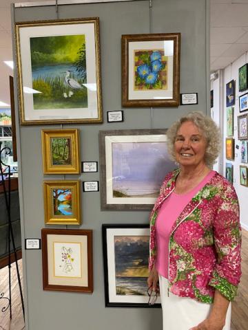 A collection of Carol Cieslik’s work is displayed in the entryway of the Columbia County Library’s downtown location. (COURTESY)