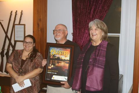 Olustee Festival photo contest winner John Clare Stokes (center) with Shannon Barker (left) and Sherri Carder during the unveiling the 2022 Olustee Festival poster. (TONY BRITT/Lake City Reporter)