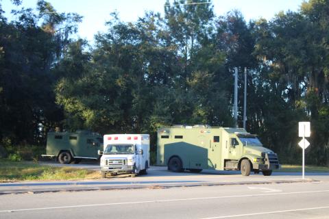 Alachua County SWAT vehicles pull onto County Road 236 in northern Alachua County following the capture of Marandoe Acell Lamar Young on Thursday. (TONY BRITT/Lake City Reporter)