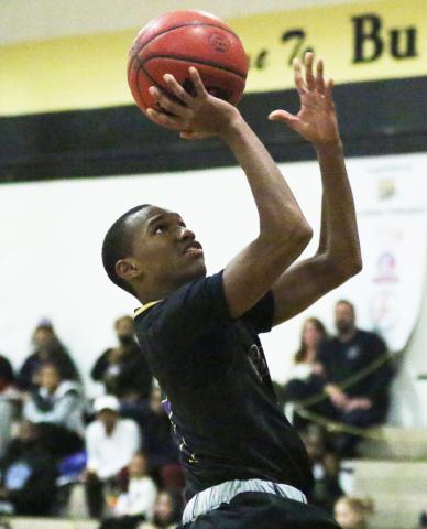Columbia guard Caden Perry rises to shoot against Buchholz on Nov. 30. (MORGAN MCMULLEN/Lake City Reporter)