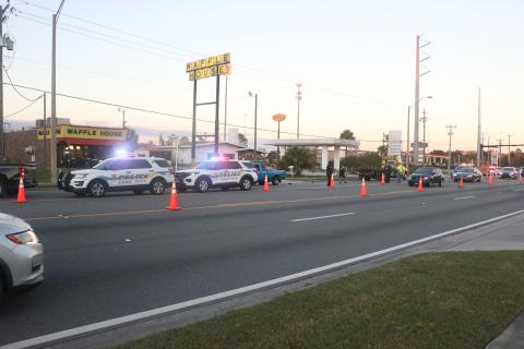 Lake City Police Department vehicles cordone off a stretch of road on U.S. Highway 90 west of Interstate 75 on Tuesday afternoon. One pedestrian was killed while no other injuries were reported. (MORGAN MCMULLEN/Lake City Reporter)