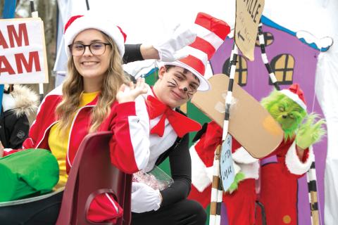 The Cat in the Hat and Grinch wave from a float during last year’s Fort White Business Council Christmas parade. This year’s parade is scheduled for Saturday at noon. (JEN CHASTEEN/Special to the Reporter)