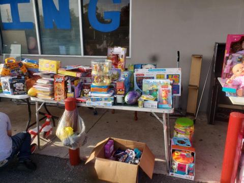 Toys and games sit outside the Kids Feeding Kids Thrift Store as volunteers worked to assemble Christmas baskets for children in need. (COURTESY)