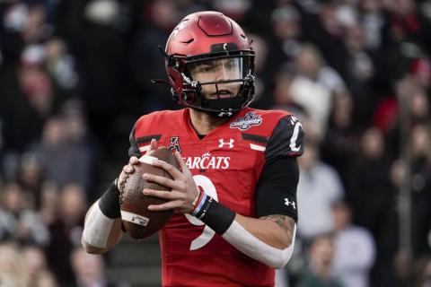 Cincinnati quarterback Desmond Ridder looks to pass from the pocket during the American Athletic Conference championship game against Houston on Dec. 4 in Cincinnati. The fourth-ranked Bearcats (13-0) get their shot in the CFP semifinal Cotton Bowl on Friday against No. 1 defending national champion Alabama. (AP File)