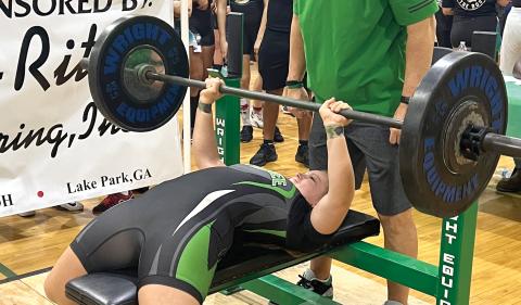 Suwannee’s Emily Gamble bench presses during the Bulldogs’ Power of Christmas invitational. Gamble placed ninth overall in the 169-pound class. (TJ VICKERS/Special to the Reporter)