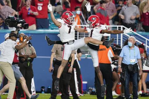 Georgia wide receiver Jermaine Burton celebrates after scoring with wide receiver George Pickens against Michigan during the Orange Bowl College Football Playoff semifinal on Friday in Miami Gardens. (LYNNA SLADKY/Associated Press)