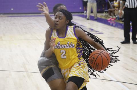 Columbia guard Na’Haviya Paxton drives by a Buchholz defender on Tuesday night. (JORDAN KROEGER/Lake City Reporter)