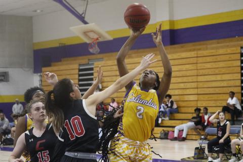 Columbia guard Na’Haviya Paxton shoots over Creekside guard Lauren Yezbick on Thursday. (JORDAN KROEGER/Lake City Reporter)