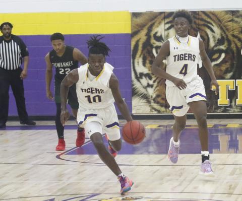 Columbia guard Isaac Broxey pushes the ball up the court in transition against Suwannee on Friday. (JORDAN KROEGER/Lake City Reporter)