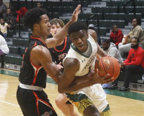FGC's Jeremiah Barze tries to get around a Johnson U. defender to shoot on Thursday night.  (JORDAN KROEGER/Lake City Reporter)