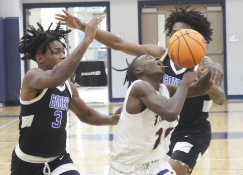 Columbia guard Isaac Broxey has the ball knocked away from him by a Godby defender during the final day of the Hitchcock’s Challenge at Legacy Park on Thursday in Alachua. (JORDAN KROEGER/Lake City Reporter)